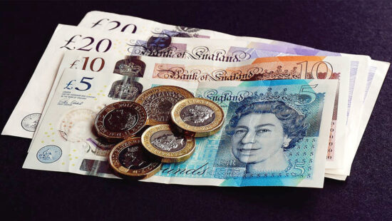 A photo shows some cash and coins.